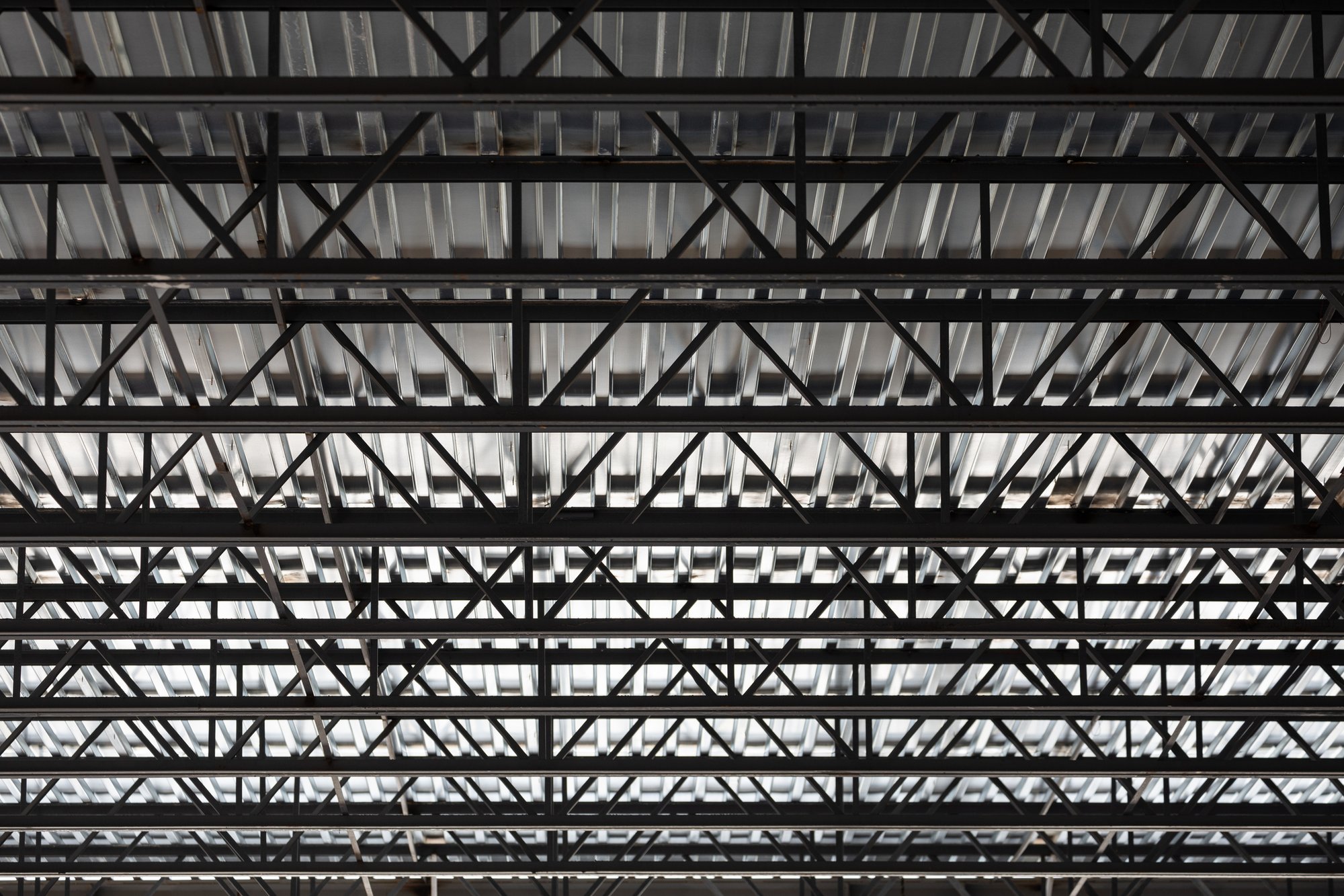 Abstract view of metal studs and support beams GettyImages-1261663724